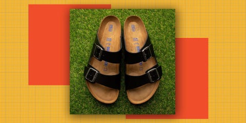 black sandals with buckles on a grassy surface