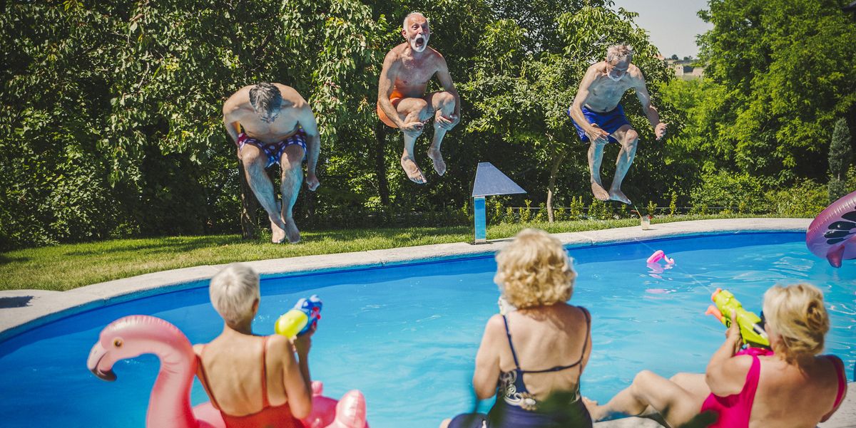 active seniors having fun at swimming pool