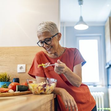 mature woman having salad for lunch
