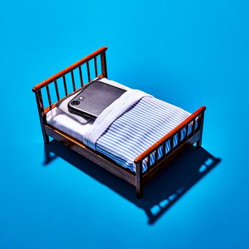 iphone sleeping in a bed screen time digital detox sleep health