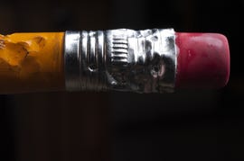 close up view of a chewed up pencil.