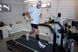 athlete running on a treadmill in a performance lab