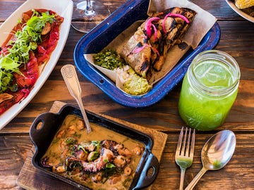 Wood-fired bell peppers, grilled octopus, beef cheek tacos and cucumber water at Finca Altozano.