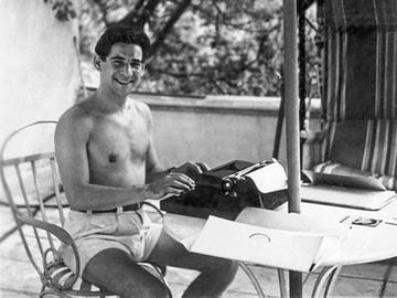 Leonard Bernstein in Hollywood, 1944, with portable typewriter.