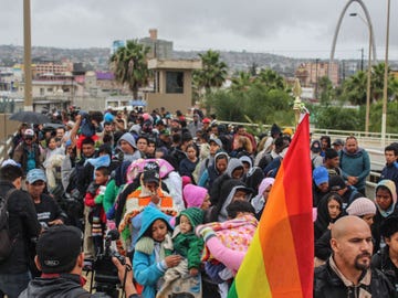 A Mexican refugee caravan passes through Tijuana en route to the Port of Entry in San Diego.