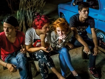 A group of Cuban kids wait for $1 pizzas in Havana in a photograph from Michael Christopher Brown’s “Paradiso” series at the Annenberg Space for Photography.