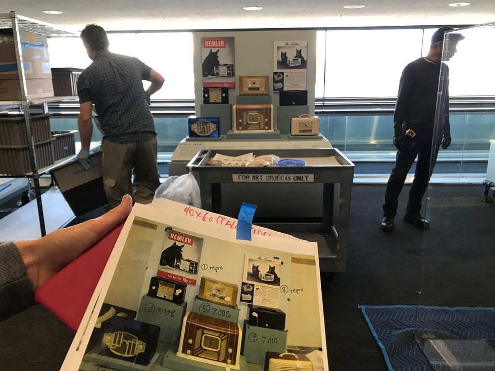 Installation staff must consult very specific layout plans designed months in advance by SFO museum curators and designers.