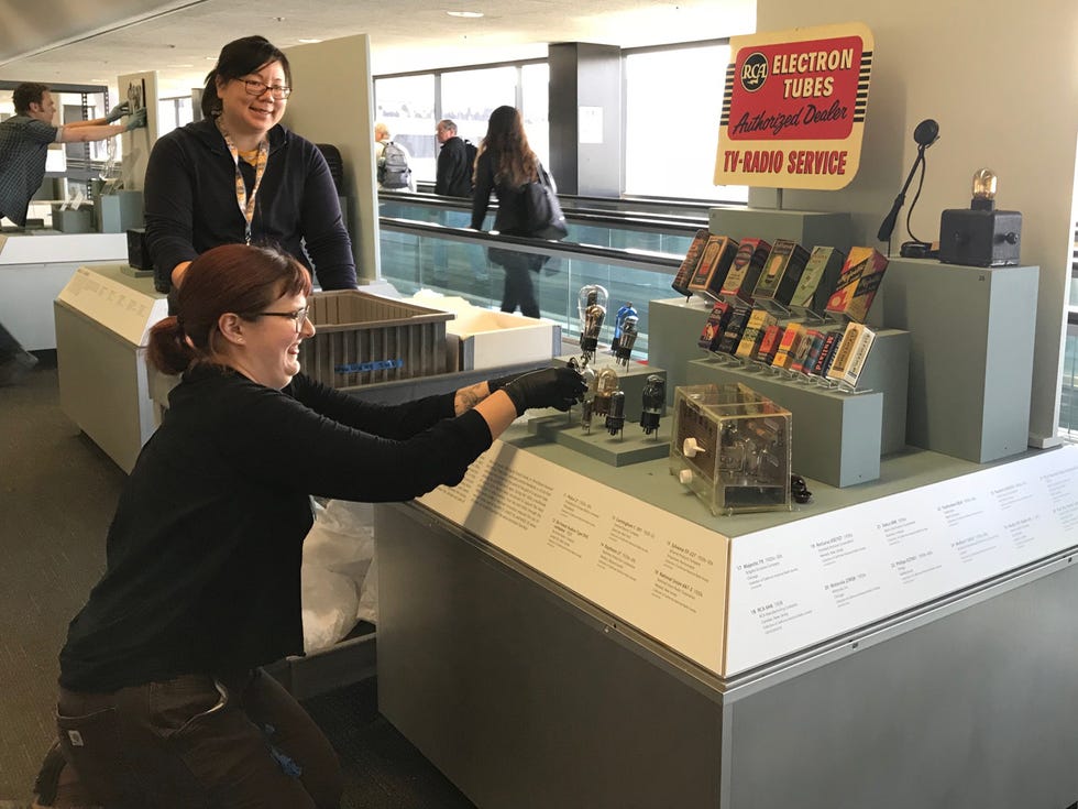 SFO Museum staff install an exhibit on the history of radio in Terminal Two.