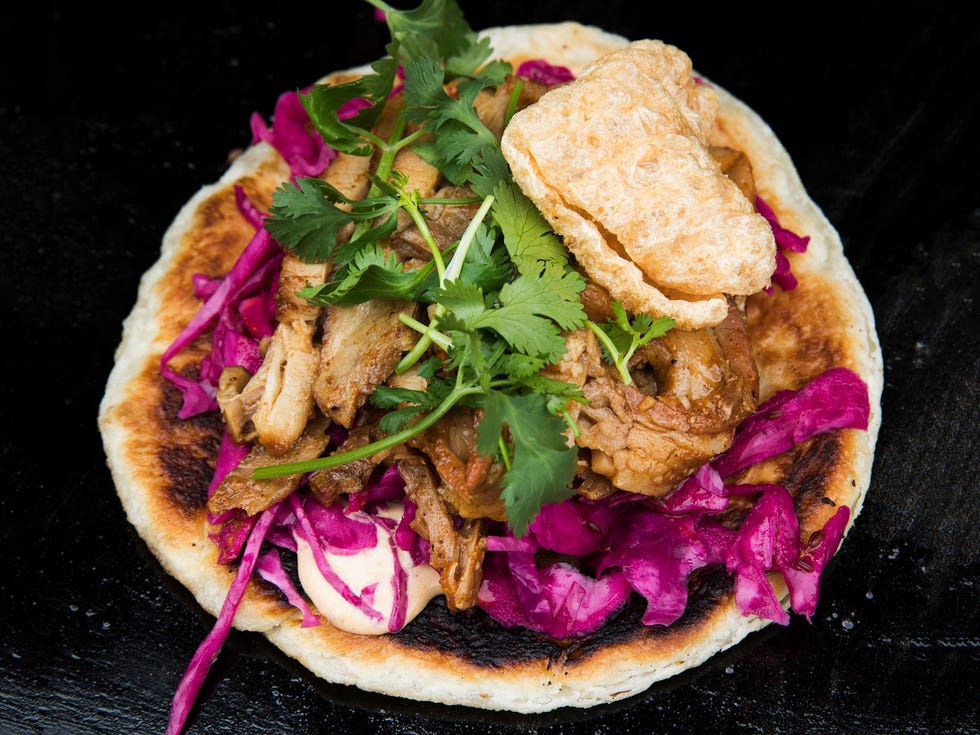 A taco from Goa Taco. Instead of a traditional tortilla, Goa Taco uses paratha, an Indian flatbread.
