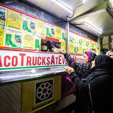 Muslim customers line up and chow down at a Taco Trucks at Every Mosque event at the Islamic Society of Orange County in Garden Grove, illustrating the increasing ethnic diversity and mix in Orange County.