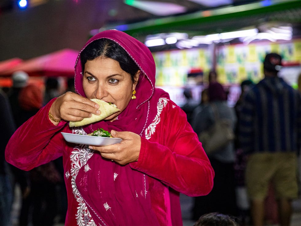 Muslim customers line up and chow down at a Taco Trucks at Every Mosque event at the Islamic Society of Orange County in Garden Grove, illustrating the increasing ethnic diversity and mix in Orange County.