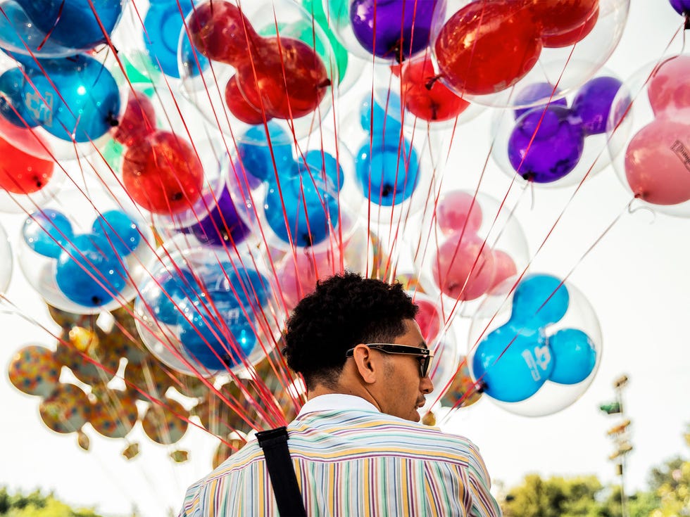 A balloon seller at Disneyland. Anaheim voters will decide in November whether to pass a living-wage ordinance for businesses, like Disney, that take subsidies from the city.
