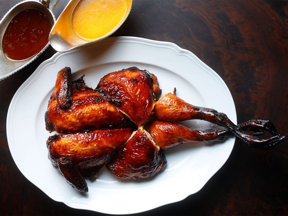 Skenes’s honey-coated whole chicken resembles a lacquered Peking duck.