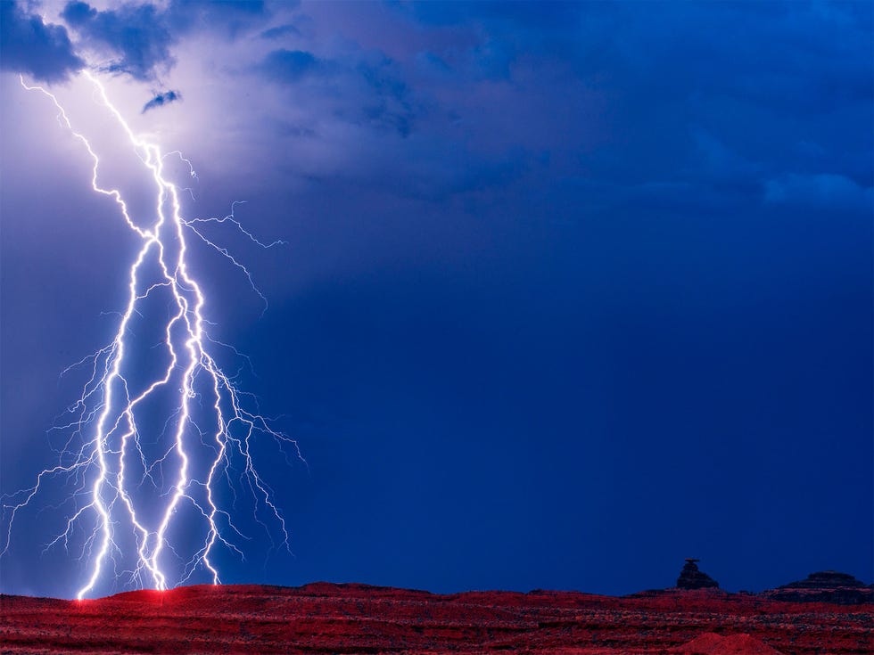Bolts of lightning near Mexican Hat Rock, which marked the southern border of the original Bears Ears National Monument.