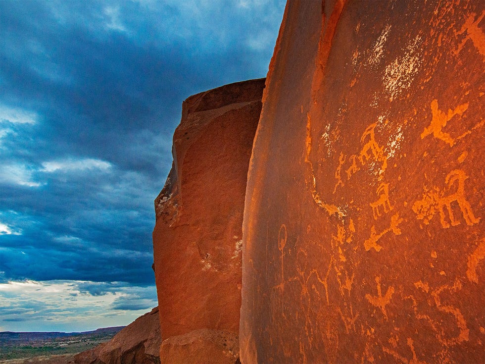 Ancient Native American petroglyphs carved into a sandstone boulder beneath Comb Ridge, which is still protected by Bears Ears National Monument. Countless other archaeological sites now fall outside the monument’s new — and contested — boundaries.