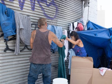 Jeff Chavez and his girlfriend have made their home in a makeshift tent on Skid Row for the past five years. Every two weeks, the couple decamp to make way for street cleaning.