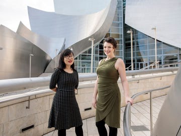L.A.-based composers Carolyn Chen, left, and Julia Adolphe outside the Walt Disney Concert Hall. Both of their works were performed by the Los Angeles Philharmonic as part of its 100th-anniversary celebration.