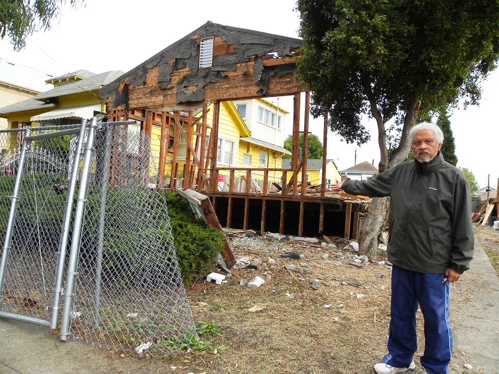 Reed outside a neighborhood crack house being demolished in 2010.