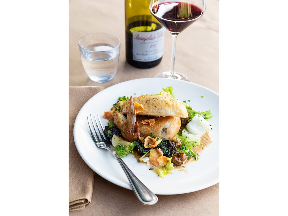 Poule au pot consists of rotisserie chicken, prune d’agen, sunchokes, turnip, chicory, and vinegar sauce, paired with beaujolais.