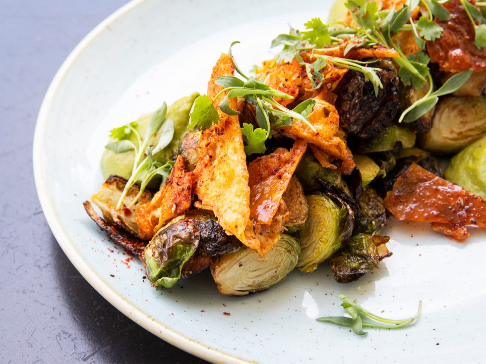 A dish of brussels sprouts includes chicken skin, revealing chef Peter McNee’s inventive combinations.