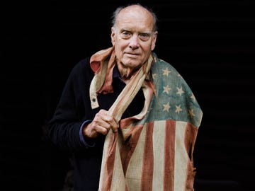 David Harris draped in a beloved American flag passed down through his family, at his home in Marin County, California, on March 20, 2019.