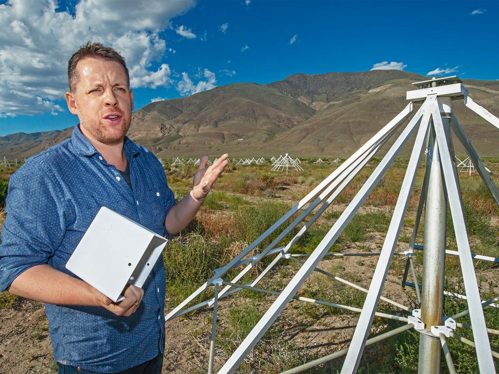 Caltech professor Gregg Hallinan examines the receiver from one of the antennae he designed for the Long Wavelength Array. His team can build an antenna in as little as 15 minutes.