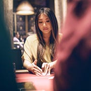 ATA100119poker_img01 Maria Ho playing a hand during the six-week-long World Series of Poker in Las Vegas this year. The L.A. resident competed in 30 of the series’ nearly 90 events and made frequent appearances as a poker analyst on ESPN during the tournament.