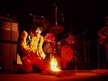 Jimi Hendrix lighting his guitar on fire, Monterey Pop Festival, Monterey, California, 1967.