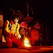 Jimi Hendrix lighting his guitar on fire, Monterey Pop Festival, Monterey, California, 1967.