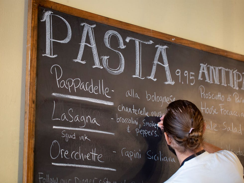 The daily specials at Il Corvo include pastas, salads, appetizers, and wines.