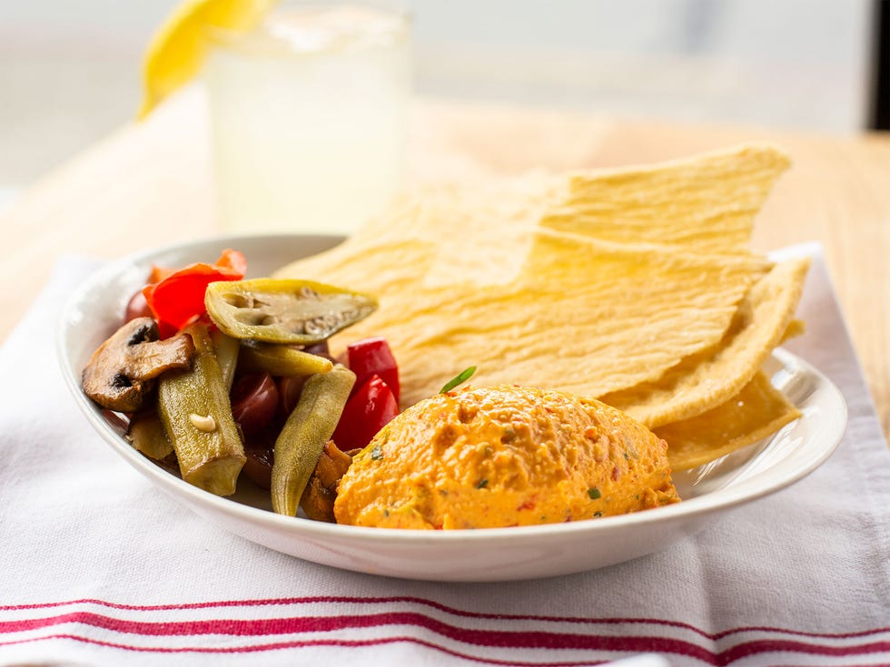 Pimento cheese spread, housemade saltines, and pickled vegetables.
