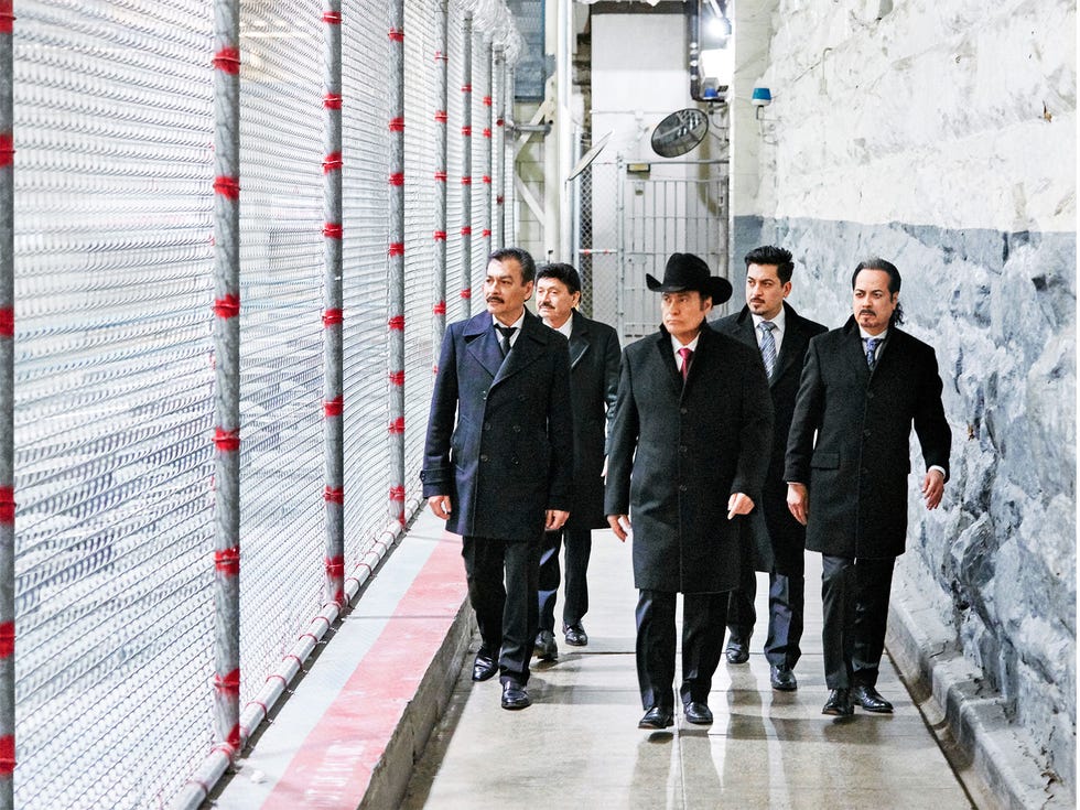 Members of the norteño band Los Tigres del Norte walk the grounds of Folsom State Prison in April 2018. Their concert there is the subject of a Netflix documentary, Los Tigres del Norte at Folsom Prison, and was recorded for a live album of the same name.
