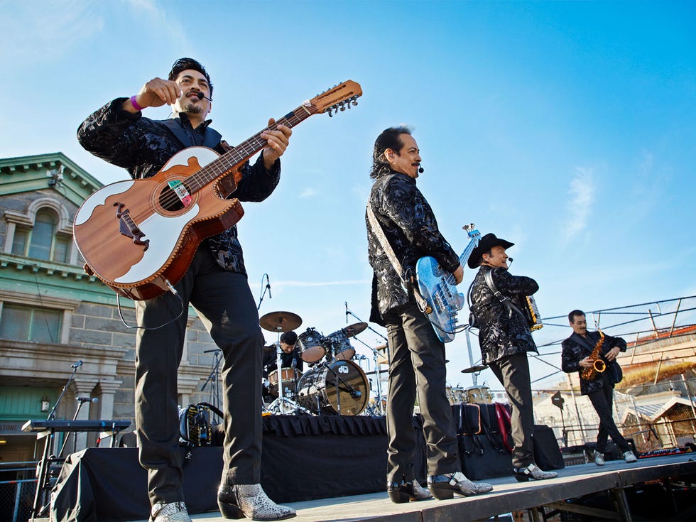 Los Tigres del Norte perform for about 800 male inmates in front of Folsom Prison’s Greystone Chapel.
