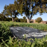 ATA010720tomb_img01 a black headstone marks the grave of juan peña diaz, an undocumented worker from mexico who was killed by anaheim police in 1953