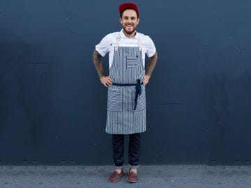 The Sailor Classic Apron ($109) has brass hardware and a leather neck strap, and is made from indigo striped denim.