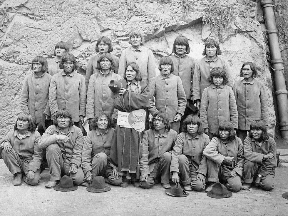 The Hopi men visit Mayor Adolph Sutro’s mansion. Lomahongiwma (center) wears a ceremonial robe and a sash and holds an army officer’s hat.
