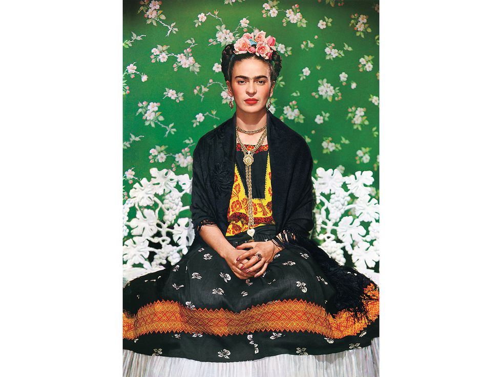 Frida on White Bench, New York City, by Nickolas Muray (1939). Kahlo sat for this photograph during one of her trips through the U.S. While visiting American cities with her husband, Rivera, she noted that “all the painters want me to pose for them.”