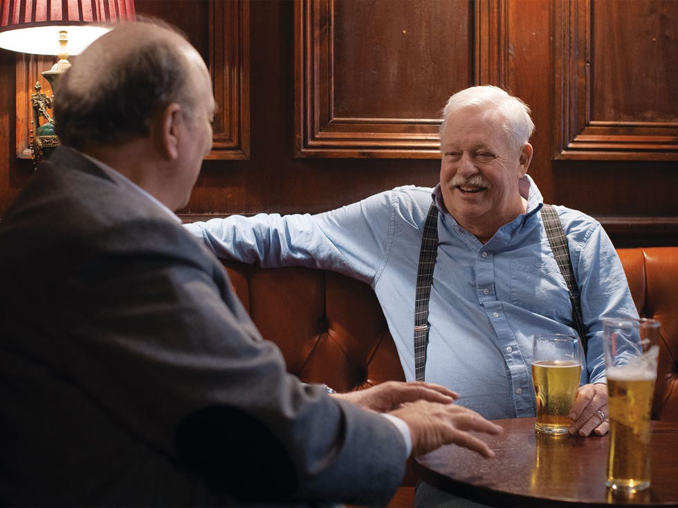 alta editor and publisher will hearst left and writer armistead maupin enjoy pints of ale at comptons of soho, a london pub