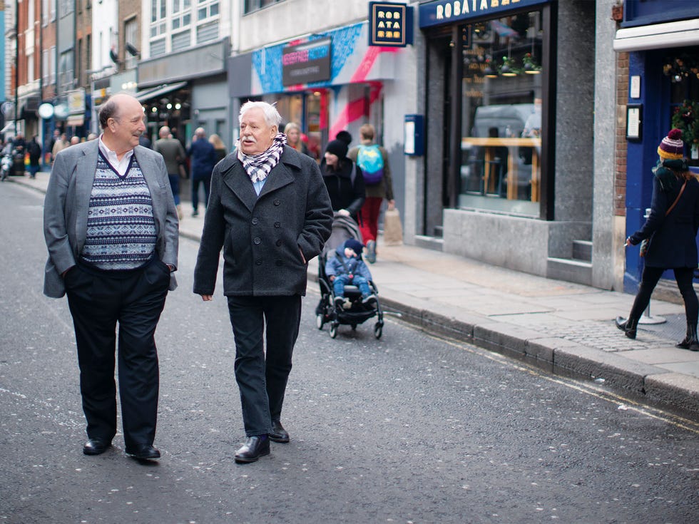 Hearst (left) and Maupin stroll along Old Compton Street in London.