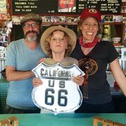 en route to their final destination of santa monica, the author far right, her husband, ed, and their son, isaac, stop at the bagdad cafe located in the mojave desert, it was the filming location for the 1987 german film of the same name