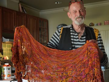 Huib Petersen with a crocheted shawl.