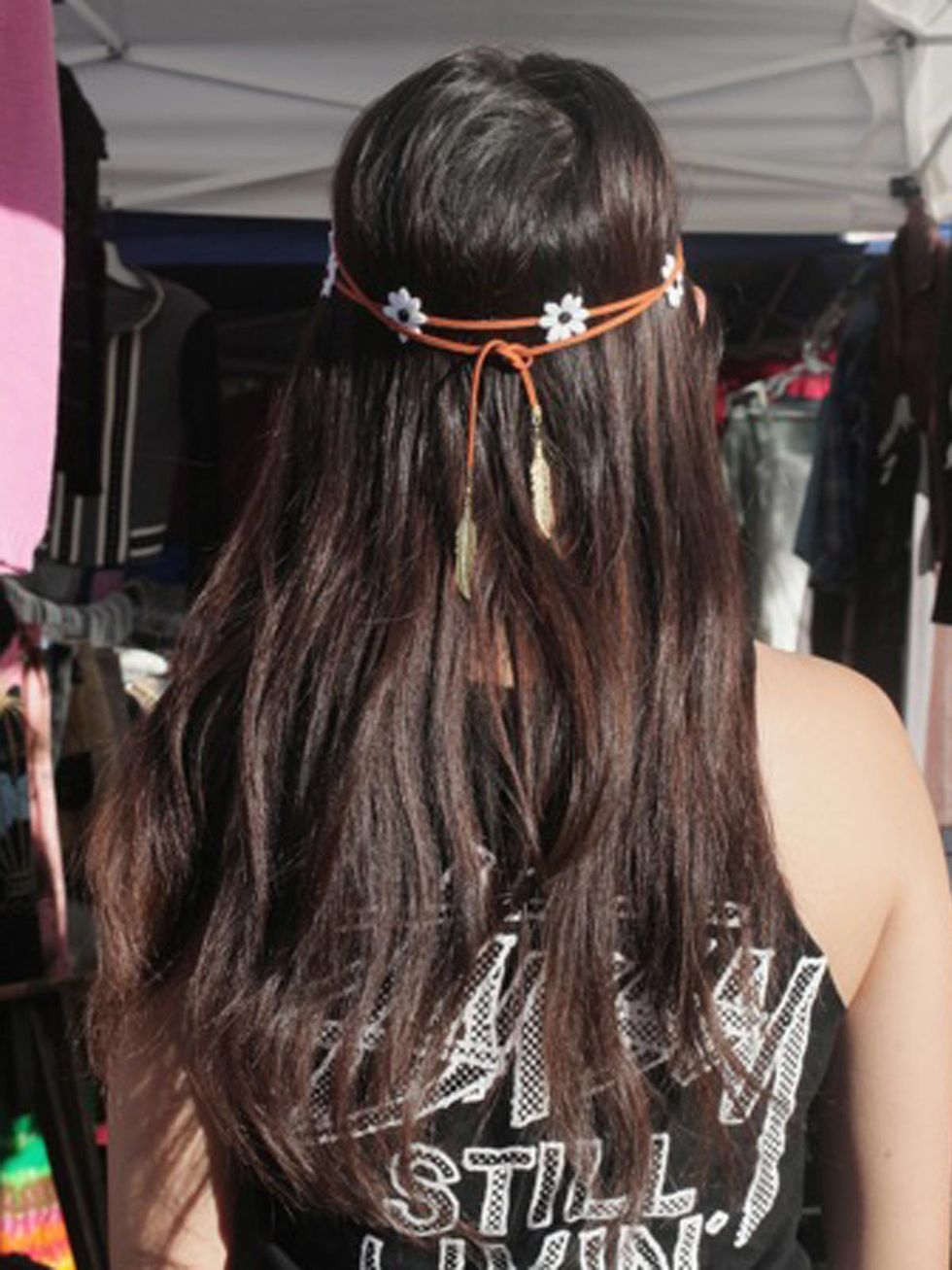 Hairstyle, Sleeveless shirt, Style, Costume accessory, Long hair, Hair accessory, Brown hair, Musical instrument accessory, Back, Active tank, 