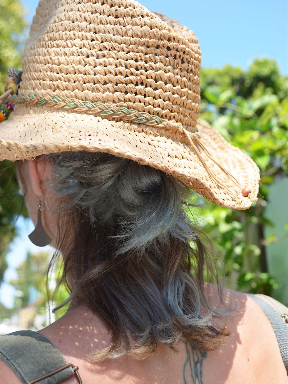 Human, Hairstyle, Skin, Hat, Shoulder, Joint, Summer, People in nature, Headgear, Fashion accessory, 