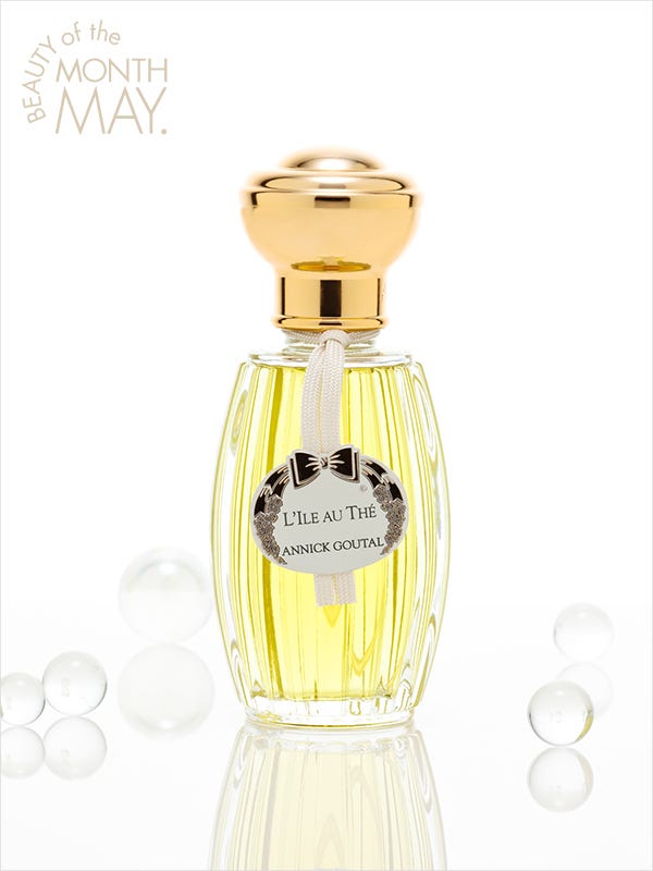 Perfume, Product, Yellow, Bottle, Glass bottle, Glass, Barware, Bottle cap, Beige, Distilled beverage, 