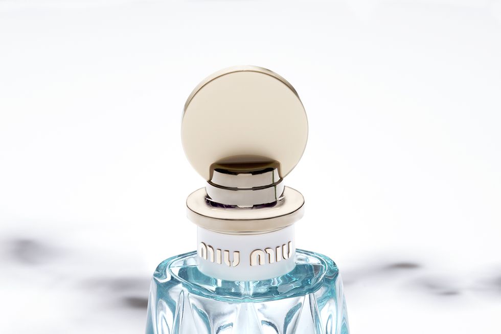 Perfume, Blue, Aqua, Product, Bottle, Glass bottle, Water, Glass, Liquid, Still life photography, 
