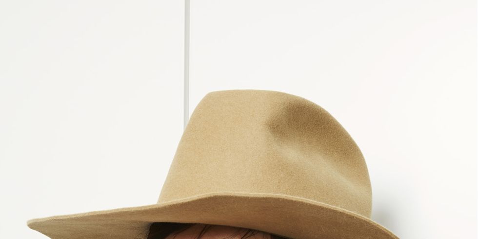 Clothing, Hat, Lip, Brown, Hairstyle, Skin, Sleeve, Chin, White, Fashion accessory, 