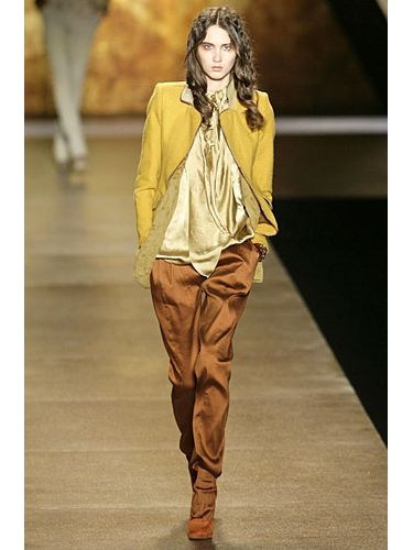 Brown, Yellow, Sleeve, Human body, Fashion show, Textile, Joint, Outerwear, Style, Runway, 