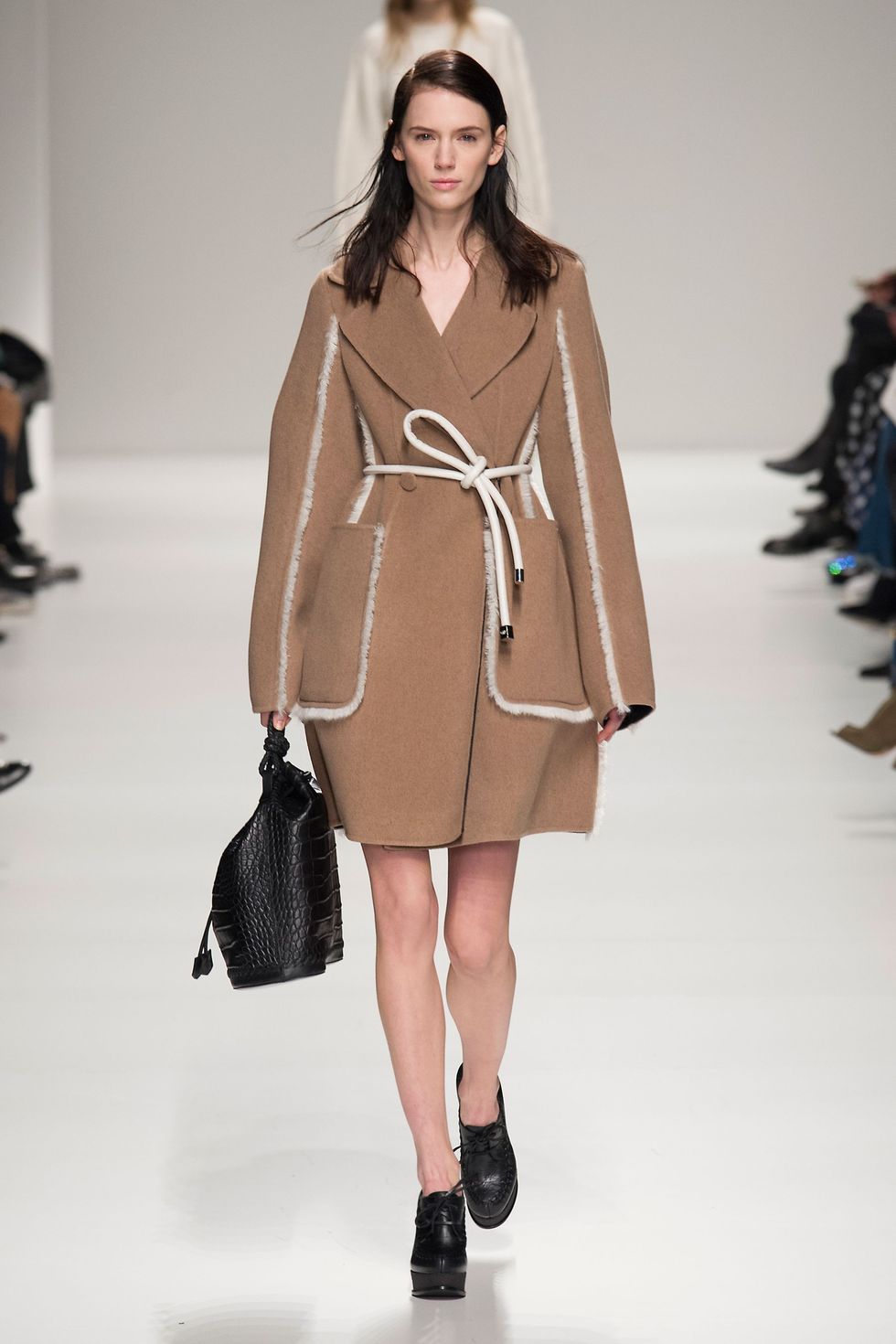 Clothing, Brown, Fashion show, Sleeve, Shoulder, Textile, Joint, Outerwear, Runway, Fashion model, 