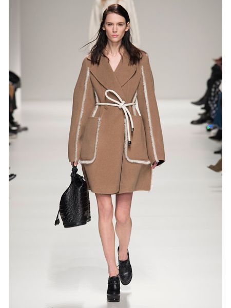 Clothing, Brown, Sleeve, Fashion show, Shoulder, Textile, Joint, Outerwear, Style, Fashion model, 