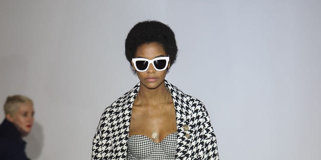 Fashion model, Fashion show, Fashion, Runway, Clothing, Shoulder, Eyewear, Outerwear, Joint, Sunglasses, 